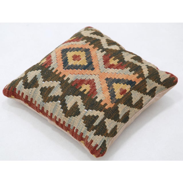 A one-of-a-kind handwoven Afghan wool kilim accent pillow featuring hooked concentric diamond. Cut and sewn by hand from a...