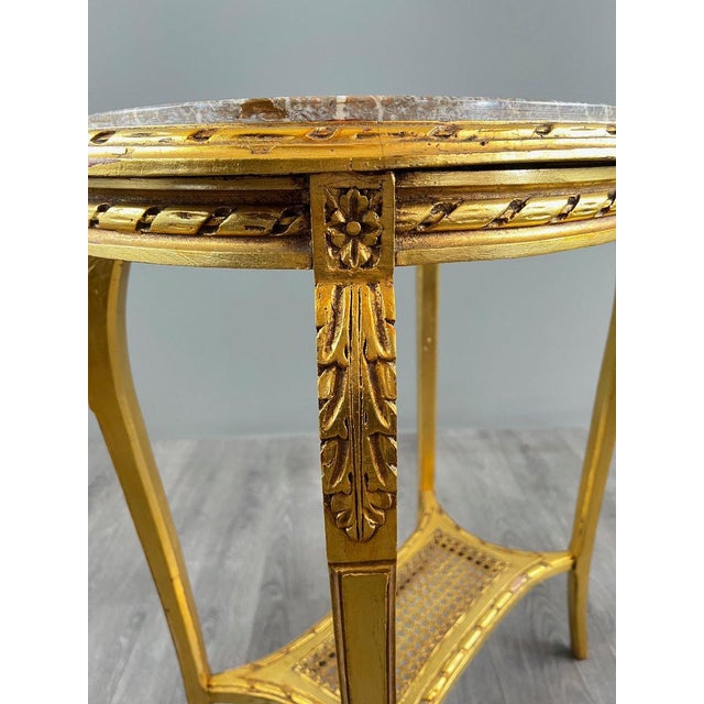 Louis XVI Style Side Table, Early 20th Century An elegant Louis XVI style side table, crafted from finely carved giltwood...