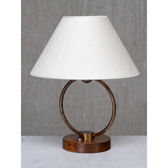 This rare table lamp was produced in Sweden in the late 1940s, in the Swedish Modern style. The graphic design is composed...