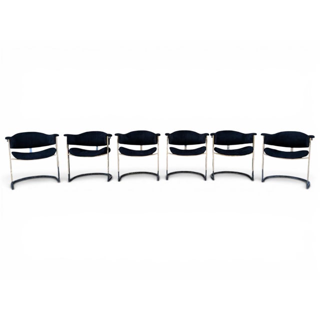 These elegant dining chairs, made in Italy in the 1970s, feature a cantilevered chromed steel frame with a square profile...