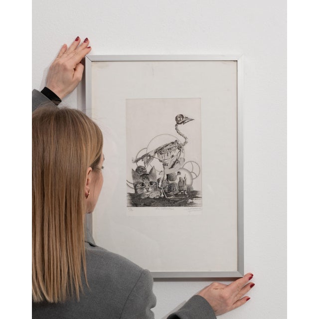 This mid 20th century print from Belgium is a print, housed in a wood and glass frame. Its design carries the Surrealism...