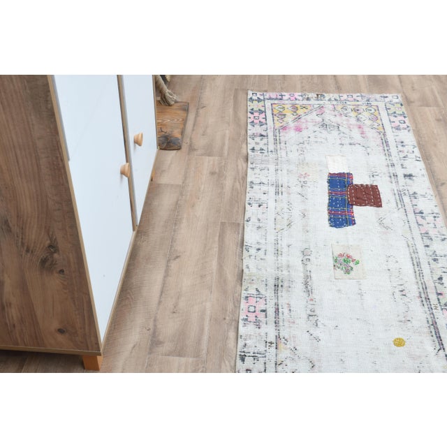 Vintage Turkish Hand-Knotted vintage rug is a semi- vintage runner rug.'70s Eastern region of Turkey's unique rug is...