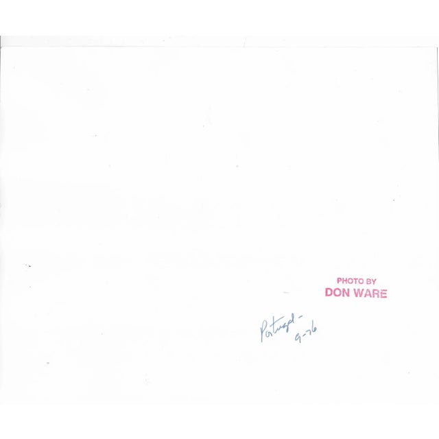 1976 black and white photo by Los Angeles photographer Don Coleman Ware (1921-2006) of patrons outside a Portugal cafe....