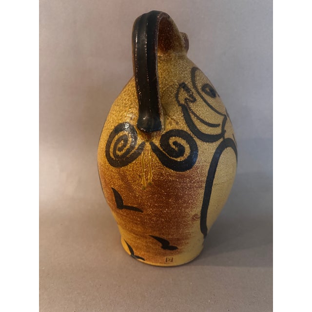Seagrove, NC, stoneware jug with applied fertility female figures, a contemporary version of traditional Southern folk...