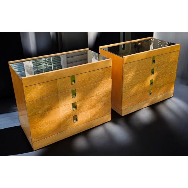 This Vintage Pair of Baker Furniture Birdseye Maple Bachelor's Chests on Stands (Attributed to Brian Palmer) epitomizes...