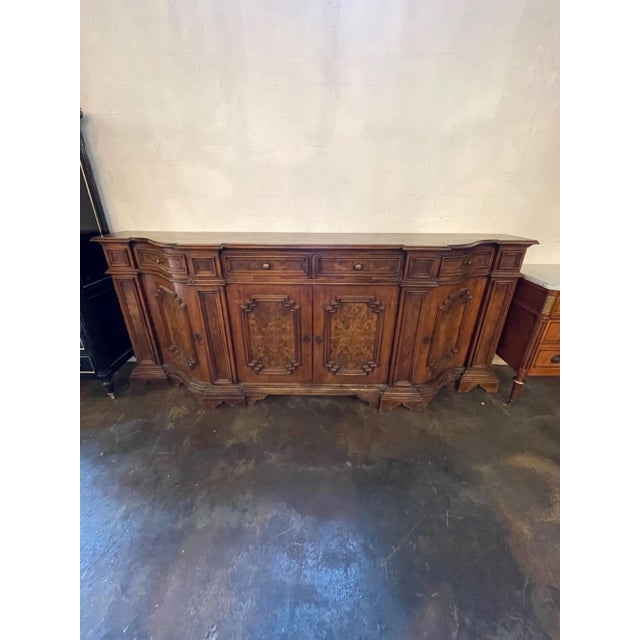 Very fine 19th century large carved Tuscan sideboard. Made of beautiful walnut with lovely carvings and tons of storage....
