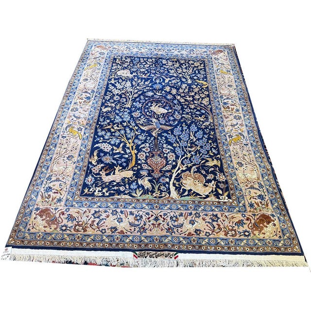 A signed silk & wool on silk foundation Persian Isfahan rug is a high-quality, hand-knotted Persian carpet from the city...