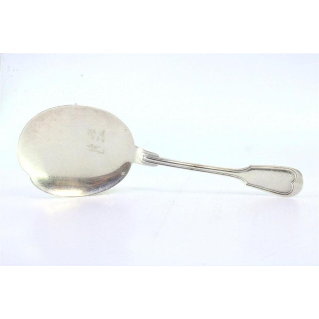 Silver ice cream scoop for right-handed people with grooves along the handle This piece has an attribution mark, I am sure...