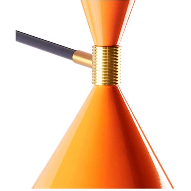 Make Waves. Our Ripple articulating lighting collection features poppy orange shades trimmed with white rippled edges....