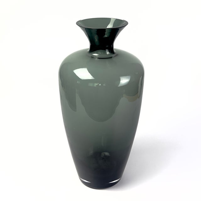 Bring timeless sophistication to your home with this striking vintage mid-century modern art glass vase. Crafted with an...