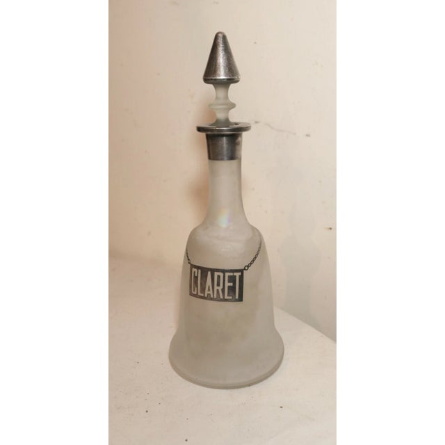 Up for sale is a very nice quality antique sterling silver over frosted glass claret decanter. The bottle is made of thick...