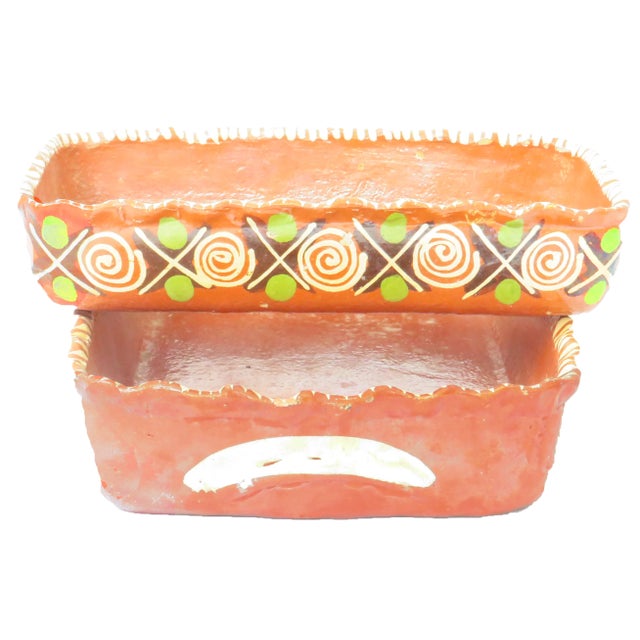 Pair of charming Mexican glazed terra cotta rectangular baking pans. Colored in the hues of the Mexican flag (red, green,...