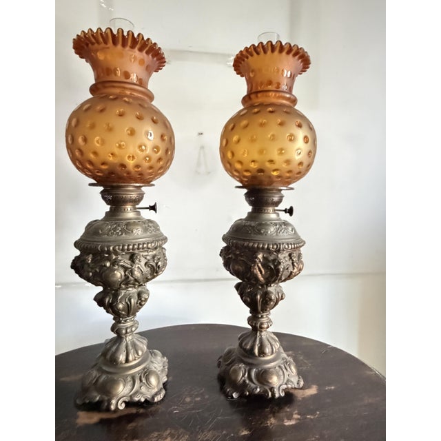 Set of two bronze and amber glass oil lamps, 1930 Intact and in good condition. Found in a noble apartment in my hometown,...