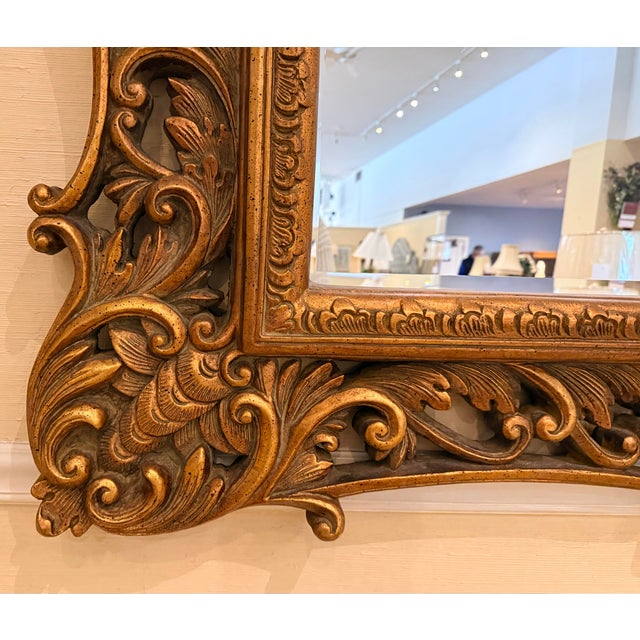 Ornate exquisite oversized 67-inch gilt wood beveled mirror with richly carved scrolling acanthus frame, perfect for...