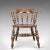 This is an antique, bow-back chair, sometimes referred to as a 'Smoker's' or 'Captain's' chair. An English, Victorian,...