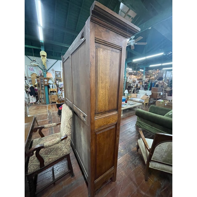 Wood Antique French Provincial Oak Armoire With Carved Floral Panels For Sale - Image 7 of 8