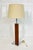 Elegant vintage table lamp designed by Walter Von Nessen, featuring a refined combination of warm walnut wood and polished...