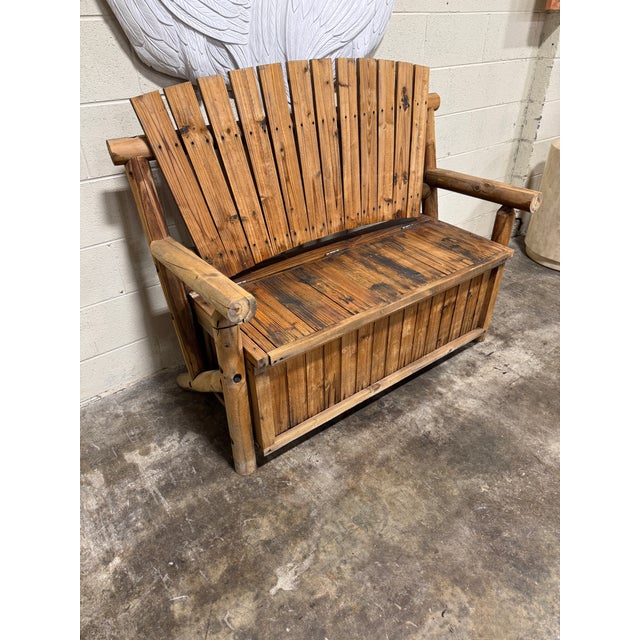 This not not your typical bench. Heavy log frame and lift up seat for storage. Really a great piece for a porch. Seems to...