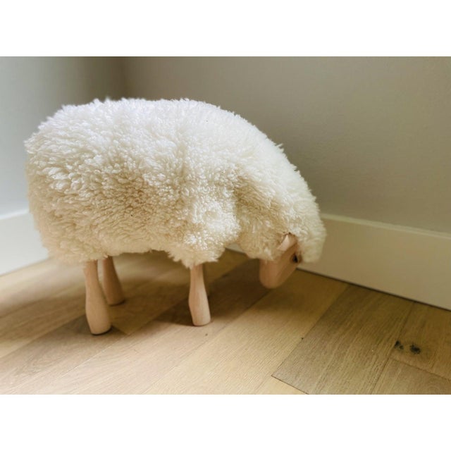 Lalanne style sheep made of wood, leather ears, and sheepskin.