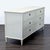 This Restoration Hardware dresser features a classic antique white finish and six spacious drawers with elegant metal ring...
