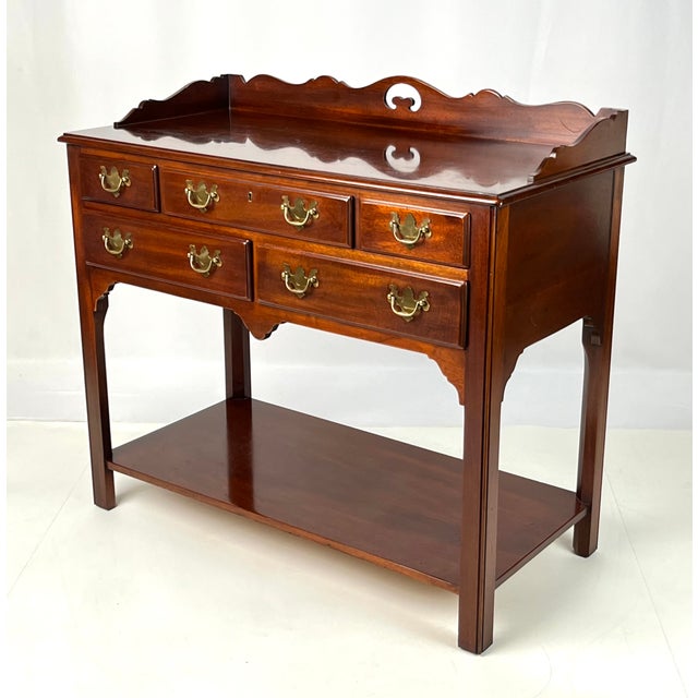 Vintage Chippendale-style server by renowned maker Hickory Chair Company. Crafted in warm solid mahogany, this piece...