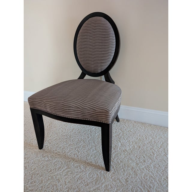 Here is the versatile, modern classic chair by Barbara Barry for Baker Furniture. This chair is perfect for handy extra...