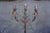 Spanish Revival wrought iron candelabra floor lamp, dating to the 1920s, featuring an ornate three-light design with...