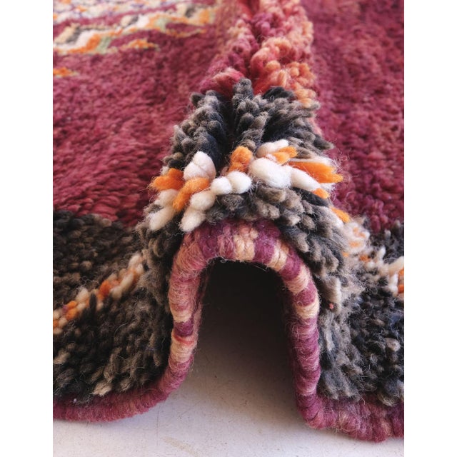 Embrace the spirit of bohemian luxury with our authentic Moroccan Vintage Boujaad Wool Rug. Hand-woven from premium wool...