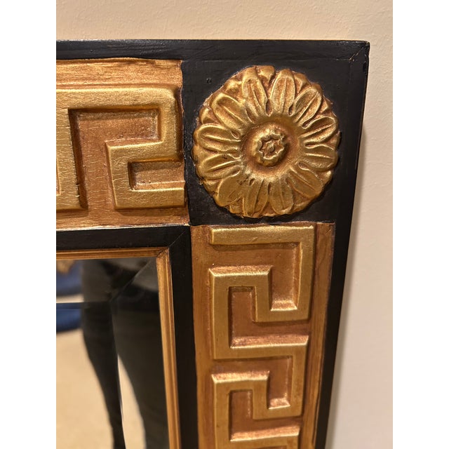 Spectacular large Hollywood Regency style gold leaf and ebonized rectangular mirror with beveled mirror. Can be hung...