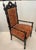 This piece is a diminutive Napoleon II Gothic Revival accent armchair, popular during the mid-to-late 19th century...