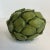 We love the gorgeous green color of this decorative Artichoke. It’s a tabletop decorative object that’s colorful and has...