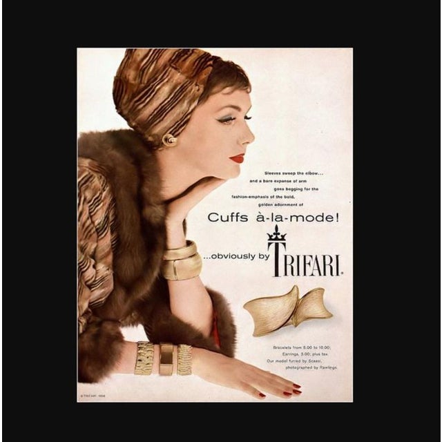 Rhodium plated textured and smooth Asian inspired "waves" articulated bracelet with box clasp and security chain. Marked...