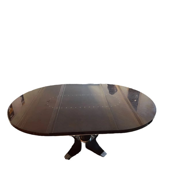 Gorgeous Evanson Dining Table with one extension leaf. The lacquered finish is timeless with silver accents. The top of...