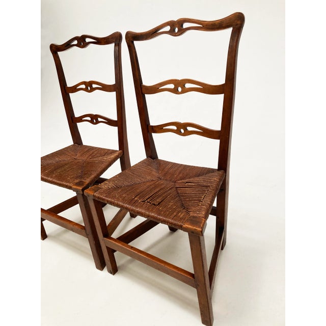 If these two chairs could speak, the history they might share. These rare and very early chairs are hand carved and...