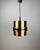 This vintage brass pendant lamp was produced by doria leuchten in germany during the 1970s, a period known for refined,...
