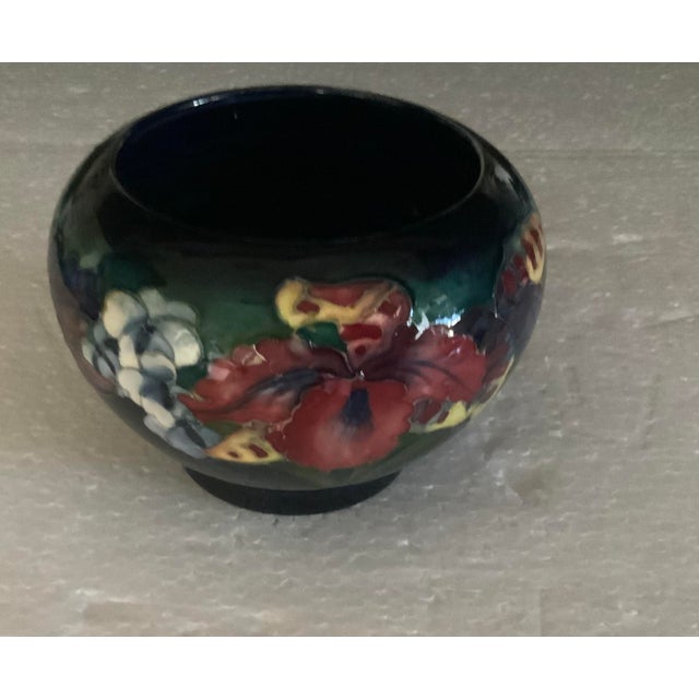 Cobalt background blends into shades of magenta, pink, purple and green glazes
