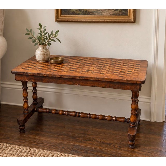 Charming 19th-century Victorian occasional table featuring an elaborate geometric tumbling-block parquetry top composed of...