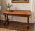 Charming 19th-century Victorian occasional table featuring an elaborate geometric tumbling-block parquetry top composed of...