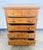 A charming and honest early 20th-century pine chest of drawers, full of character and warm, sun-washed patina. The piece...