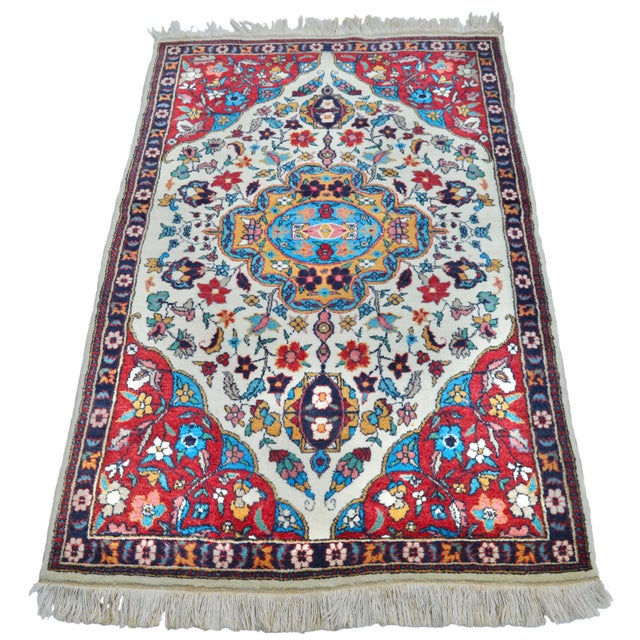 One-of-a-kind antique Persian Sarouk rug, meticulously hand-knotted in natural wool. Featuring elaborate large bright-blue...