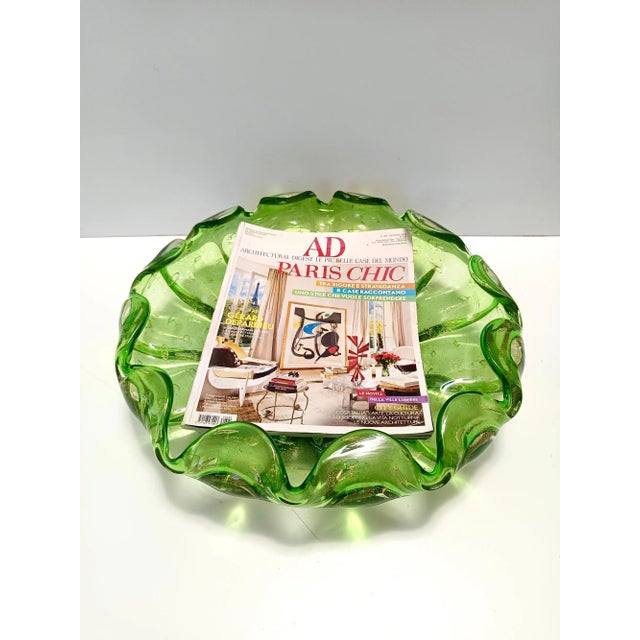 Made in Italy, 1960s This is a thick and heavy green bilicante Murano glass bowl with gold leaf. It is a vintage piece,...