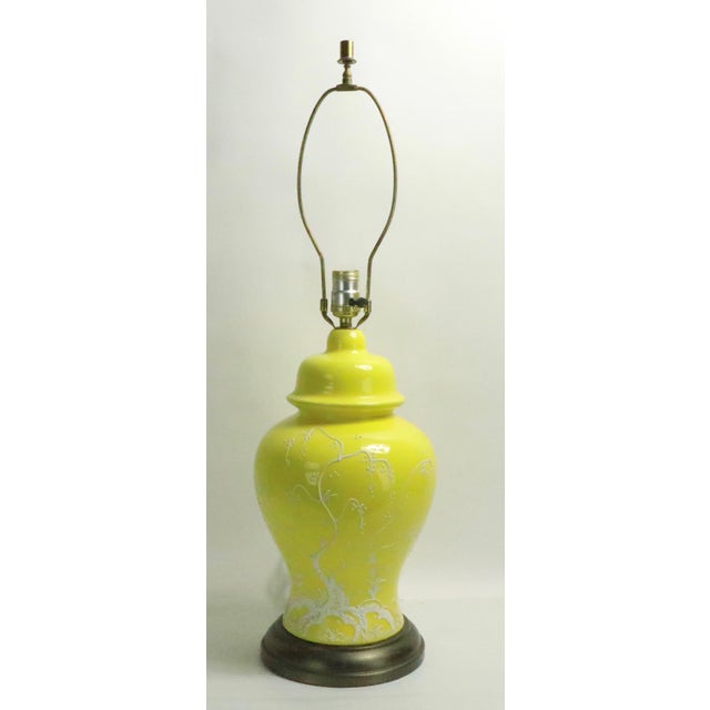 Cheerful and bright yellow Chinese style table lamp, with applied stylized tree in flat white paint finish. This lamp is a...