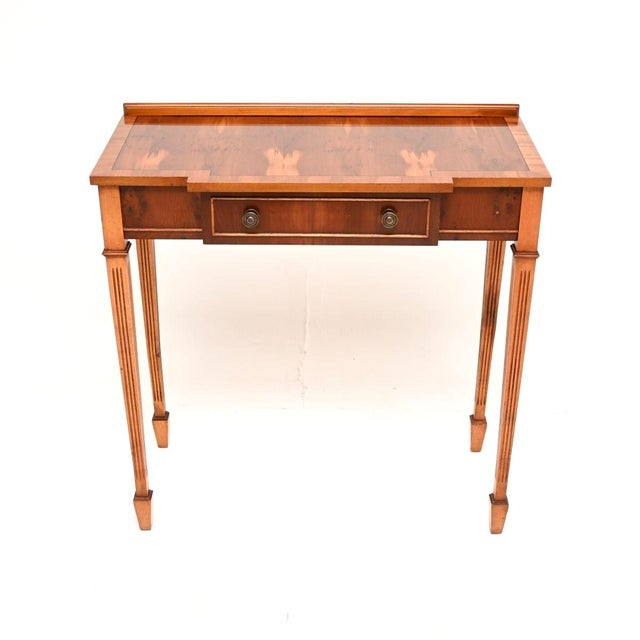 A beautiful and elegant antique Georgian style yew wood console table. This was made in England, it dates from around the...