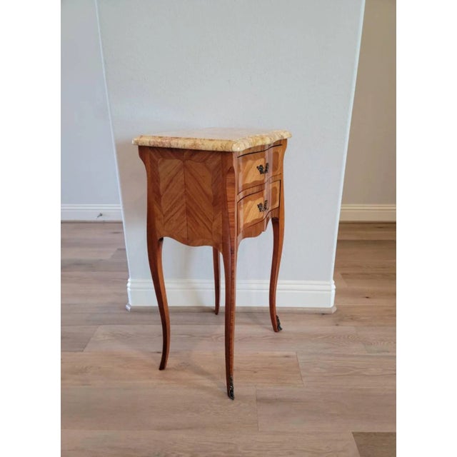 An elegant vintage French Louis XV style mahogany parquetry chest of drawers nightstand by Camaro. circa 1960 Born in...