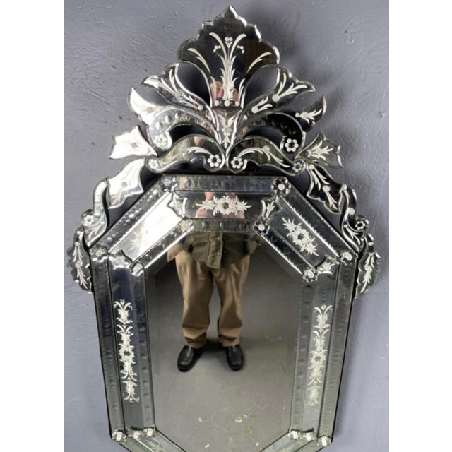 A large and impressive Italian Venetian style mirror