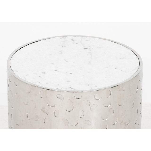 Gallet and Dauzet "Biafo" Side Table, textured Carrara iceberg marble top above cylindrical hand-hammered stainless steel...