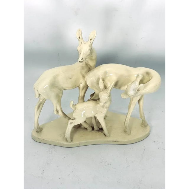 Ceramic sculpture representing a family of young deer in good vintage condition with trace of age and use. Produced in...