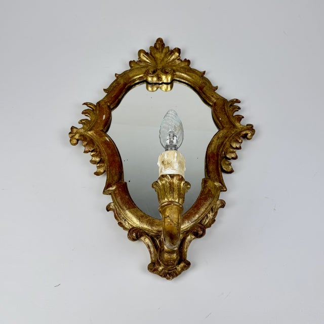 Vintage Rococo Style Gilded Wood Wall Mirror with Lamp, Italy, 1950s, in Good conditions. Designed before 1890