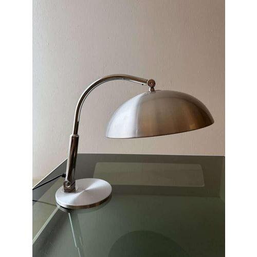 Some lamps transcend their time. This Hala desk lamp model 144, designed by H.Th.A. Busquet, is a beautiful example. The...