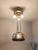 This decorative pendant lamp in the Art Nouveau/Art Deco style stands out with its artfully hand-forged metal frame and...
